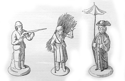 Figures de pessebre. El caçador, el llenyataire i el capellà amb un parasol