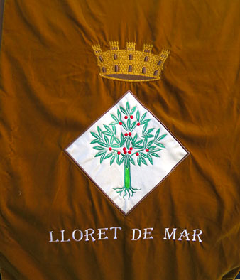 Escut al cobertor de la Mulassa Pepa Maca de Lloret de Mar